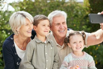 Happy older couple spending time with their grandkids