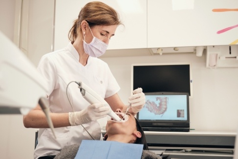 Dentist giving a patient a dental exam